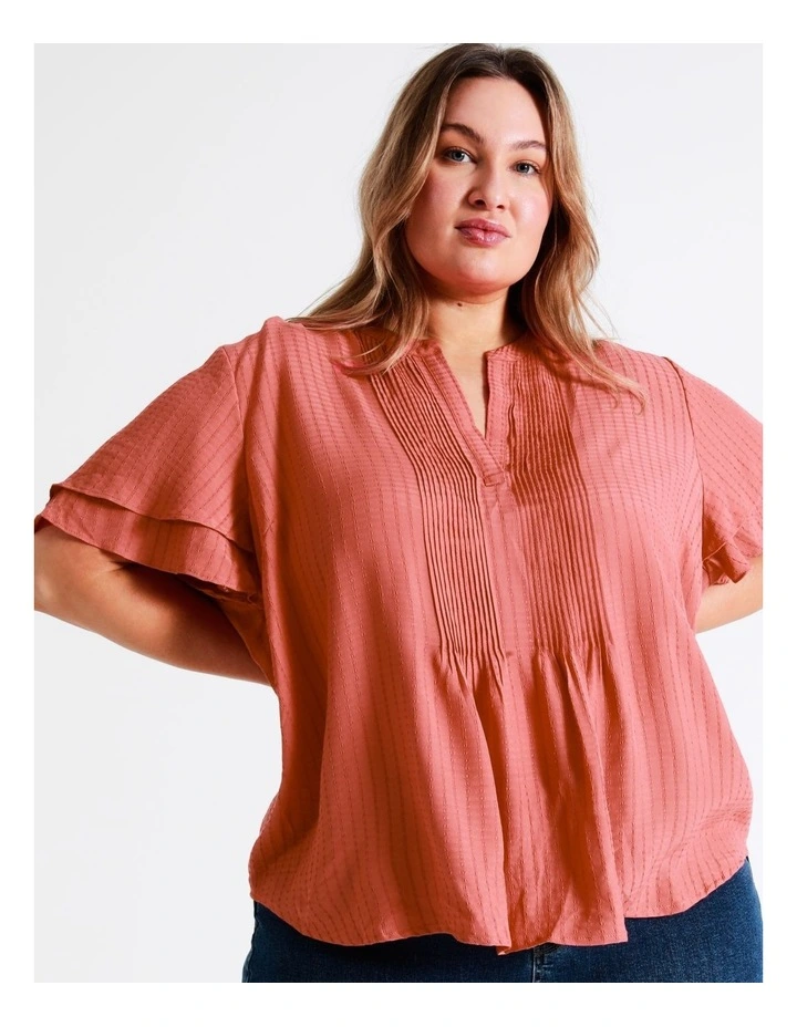 Curve Pintuck Flutter Sleeve Top In Coral